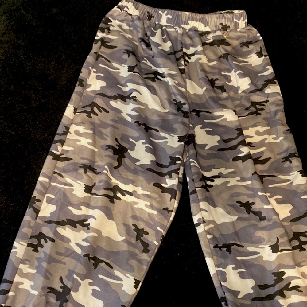 I am selling these purple,grey,black,white camo sweats, size small.